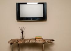 When it comes to a wall-mounted television...does it stay or does it go?